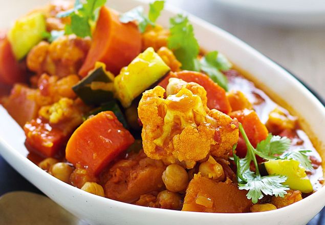 Roasted vegetable tagine with chickpeas on millet, Moroccan carrot and cilantro salad